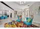 Open-concept living space with stylish furniture, a decorative rug, and seamless flow to other areas at 10218 Garden Alcove Dr, Tampa, FL 33647