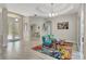 Open-concept living room with colorful rug and bright decor at 10218 Garden Alcove Dr, Tampa, FL 33647