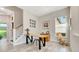 Bright office space with neutral walls, lots of natural light, and view of the home's staircase at 10218 Garden Alcove Dr, Tampa, FL 33647