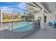 Screened-in pool features ample patio space, perfect for relaxation and enjoying the outdoors at 10218 Garden Alcove Dr, Tampa, FL 33647
