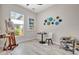 Bright room with artist easel, art supplies, and decorative wall hangings at 10218 Garden Alcove Dr, Tampa, FL 33647