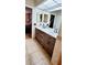 Bathroom boasts a double sink vanity with modern fixtures and stylish tile flooring at 1102 Old Mill Pond Rd, Palm Harbor, FL 34683