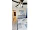 Bedroom with a blue accent wall, gray furniture, and a glimpse of the hallway at 1102 Old Mill Pond Rd, Palm Harbor, FL 34683