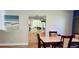 Open dining area with mirrored bar and marble table at 1102 Old Mill Pond Rd, Palm Harbor, FL 34683