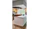 Modern kitchen features stainless steel appliances, counter seating, and bright lighting at 1102 Old Mill Pond Rd, Palm Harbor, FL 34683