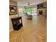 Spacious living room with hardwood floors, stone fireplace, and sliding glass doors to the deck at 1102 Old Mill Pond Rd, Palm Harbor, FL 34683