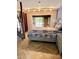 Bright bedroom with herringbone floors, barn door and a sliding glass door to balcony at 1102 Old Mill Pond Rd, Palm Harbor, FL 34683