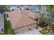 Aerial view of the home showcasing the roof, two-car garage, landscaping and surrounding neighborhood at 1220 Emerald Hill Way, Valrico, FL 33594