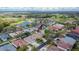 Aerial view shows the roof of the home, as well as the large back yard and white privacy fence at 1220 Emerald Hill Way, Valrico, FL 33594