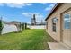 A beautiful backyard shows a well manicured lawn, shrubs, and privacy fence at 1220 Emerald Hill Way, Valrico, FL 33594