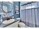 Bathroom features a tiled backsplash and vanity area plus a shower/tub combination at 1220 Emerald Hill Way, Valrico, FL 33594