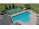 Aerial view of a community pool and basketball court, offering residents recreational opportunities at 1220 Emerald Hill Way, Valrico, FL 33594