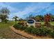 Diamond Hill Golf Club sign surrounded by lush landscaping and greenery at 1220 Emerald Hill Way, Valrico, FL 33594