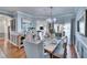 Light-filled dining room showcases hardwood floors, modern decor, and a seamless flow to the kitchen at 1220 Emerald Hill Way, Valrico, FL 33594