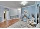 Elegant foyer with hardwood floors, light blue walls, decorative rug and stylish furnishings at 1220 Emerald Hill Way, Valrico, FL 33594