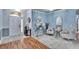 Elegant foyer with hardwood floors, light blue walls, decorative rug and stylish furnishings at 1220 Emerald Hill Way, Valrico, FL 33594