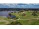 Scenic aerial view of the community golf course, lakes, and luscious green landscape at 1220 Emerald Hill Way, Valrico, FL 33594