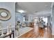 Bright living space with hardwood flooring, cozy seating, and elegant decor creates a comfortable ambiance at 1220 Emerald Hill Way, Valrico, FL 33594