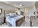 Comfortable main bedroom with bed, furnishings, ceiling fan, and neutral color palette at 1220 Emerald Hill Way, Valrico, FL 33594