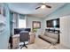 Well-lit office space with a desk, ample storage, and a comfortable sitting area, creating an ideal work environment at 1220 Emerald Hill Way, Valrico, FL 33594