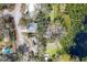 Stunning aerial view of property with a large lot, beautiful lake, and a sparkling swimming pool at 12227 Noreast Lake Dr, Tampa, FL 33612