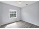 Bedroom featuring a window and light gray flooring at 12227 Noreast Lake Dr, Tampa, FL 33612