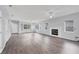 Spacious living room features hardwood floors, fireplace, recessed lighting, and plentiful windows at 12227 Noreast Lake Dr, Tampa, FL 33612