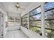 Sunroom with windows providing bright and airy view at 12227 Noreast Lake Dr, Tampa, FL 33612