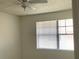 Bedroom featuring a window and white walls at 12403 Hibiscus Oak Pl # 202, Tampa, FL 33612