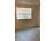Bright bedroom with new flooring and a window with lots of light at 12403 Hibiscus Oak Pl # 202, Tampa, FL 33612