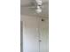 Bedroom features a white ceiling fan and a white door at 12403 Hibiscus Oak Pl # 202, Tampa, FL 33612