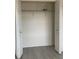 Open closet with a wire shelf and a hanging bar for clothes at 12403 Hibiscus Oak Pl # 202, Tampa, FL 33612