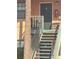 Stairway leading to unit 202, with a seating area on the balcony at 12403 Hibiscus Oak Pl # 202, Tampa, FL 33612