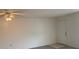 Spacious living room with ceiling fan, neutral walls, and vinyl wood flooring at 12403 Hibiscus Oak Pl # 202, Tampa, FL 33612