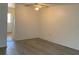 Inviting living room featuring wood flooring and neutral walls at 12403 Hibiscus Oak Pl # 202, Tampa, FL 33612