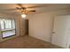 Bedroom with a ceiling fan and a window overlooking the lanai at 13304 Meadowwood Ct, Tampa, FL 33618