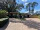 Charming home with brick driveway, mature landscaping, and well-manicured lawn creating great curb appeal at 13304 Meadowwood Ct, Tampa, FL 33618
