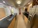 Modern kitchen featuring stainless steel appliances and granite countertops at 13304 Meadowwood Ct, Tampa, FL 33618