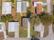 Overhead aerial shows roof lines, driveways, and yards of homes in a tightly-knit residential neighborhood at 14311 Action St, Brooksville, FL 34613