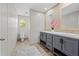 Bathroom featuring double vanity, tile backsplash, and a shower-tub combo at 14311 Action St, Brooksville, FL 34613