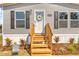 Inviting entryway with a welcoming wreath and decorative landscaping, set on a well-maintained lawn at 14311 Action St, Brooksville, FL 34613