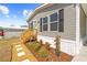 Charming single-story home with black shutters, a landscaped yard, and a cozy entrance at 14311 Action St, Brooksville, FL 34613