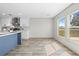 Bright kitchen boasts white cabinetry, stainless appliances, and an eat-in kitchen area at 14311 Action St, Brooksville, FL 34613