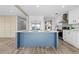 Contemporary kitchen island with a white countertop, sink, and stainless steel appliances at 14311 Action St, Brooksville, FL 34613