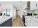 Sleek kitchen featuring modern appliances, white cabinets, and a minimalist design at 14311 Action St, Brooksville, FL 34613