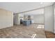 Open-concept living area with a modern kitchen island and stainless steel appliances at 14311 Action St, Brooksville, FL 34613