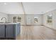 Living room features a white front door, wood-look flooring and modern decor at 14311 Action St, Brooksville, FL 34613
