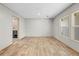 Large living room showcasing wood-look floors and ample natural light at 14311 Action St, Brooksville, FL 34613