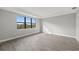 Airy bedroom featuring a large window for ample natural light and tile flooring at 1829 Pepper Grass Dr, North Port, FL 34289