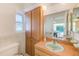 Vintage bathroom with built in cabinets, vanity sink and toilet at 1831 Kay Dr, Largo, FL 33770